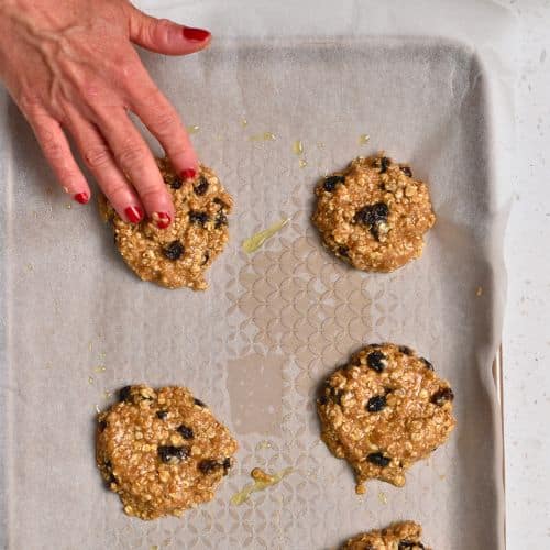 Healthy Oatmeal Cookies ready to bake on a cookie sheet.