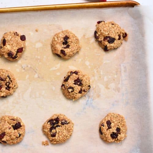 Healthy Oatmeal Cranberry Cookies ready to bake on a cookie sheet.