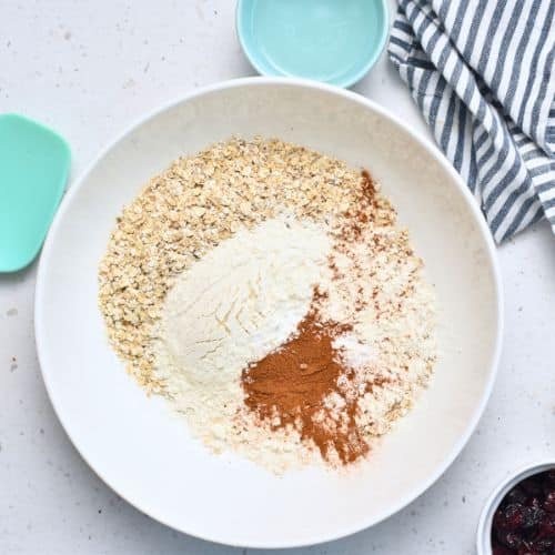 Dry Healthy Oatmeal Cranberry Cookie ingredients in a mixing bowl.