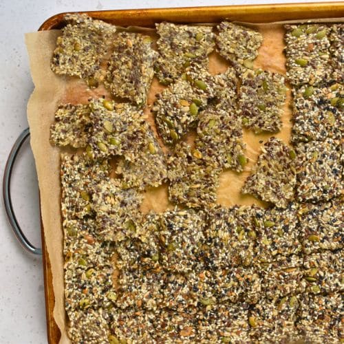 Sliced Seed Crackers on a baking sheet.