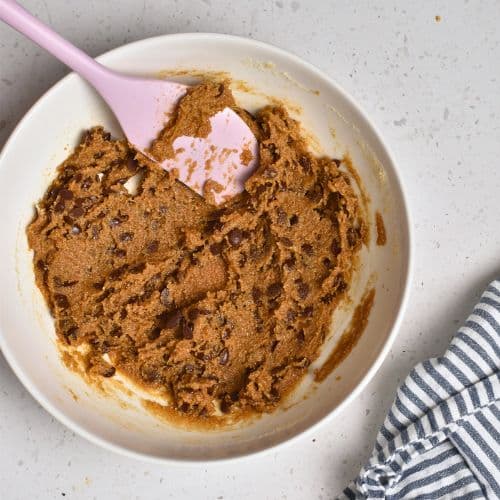 Tahini cookie batter in a mixing bowl.