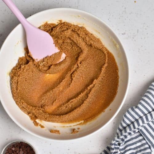 Tahini cookie batter in a mixing bowl.