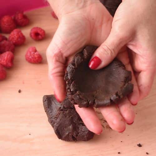 Flattening No-Bake Brownie Bite dough.