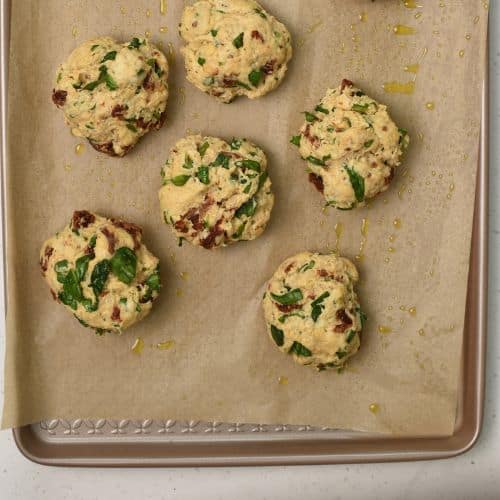 Quinoa Biscuits ready to bake on a baking sheet.