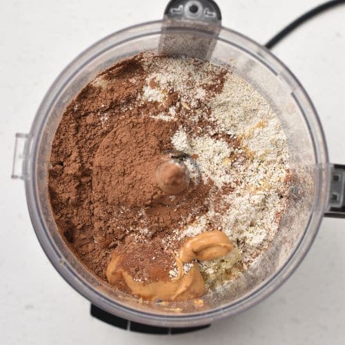 Quinoa Cereal ingredients in the bowl of a food processor.