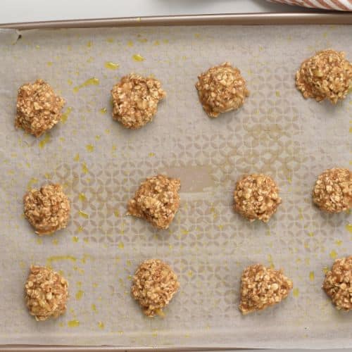 2-Ingredient Oat Cookie dough balls on a baking sheet.