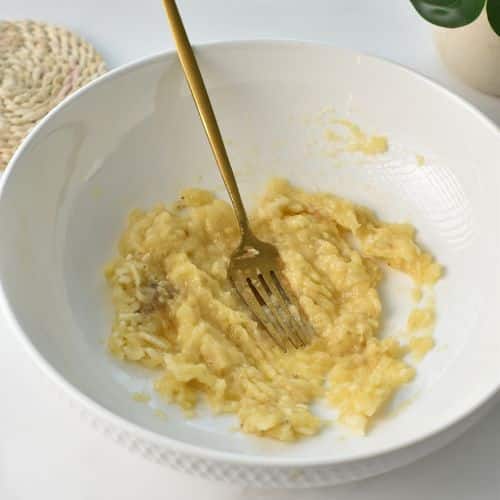 Mashed banana in a bowl.