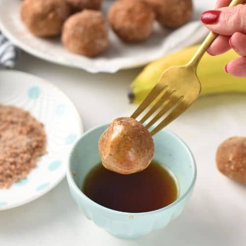 Dipping the Banana Bites in maple syrup.