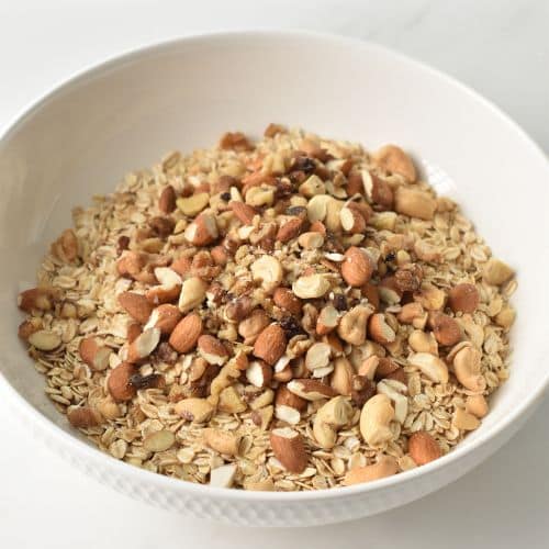 Mixing Banana Granola ingredients in a bowl.