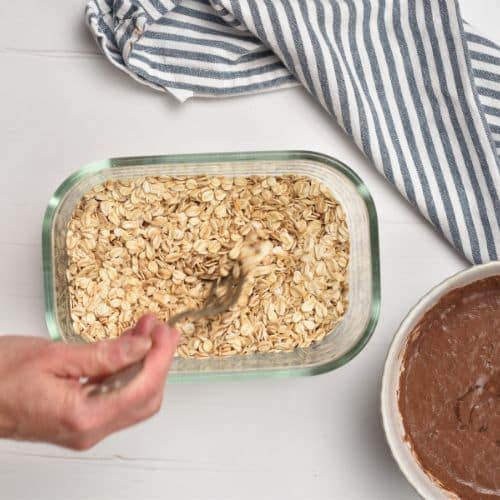 Mixing oats, chia seeds, and milk for the Chocolate Overnight Oats