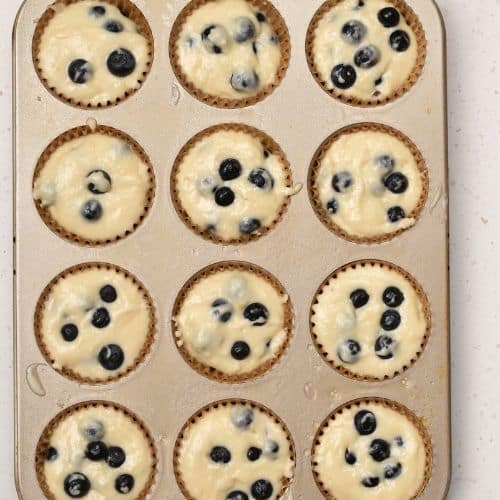 Easy Blueberry Muffins ready to bake in a muffin tin.