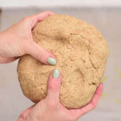 Flattening the  Flaxseed Bread dough ball.