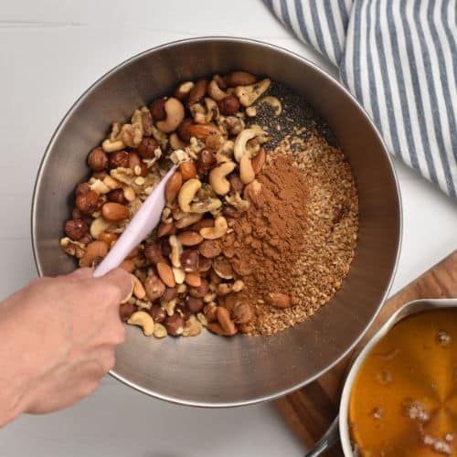 Mixing dry Healthy Homemade Granola ingredients.