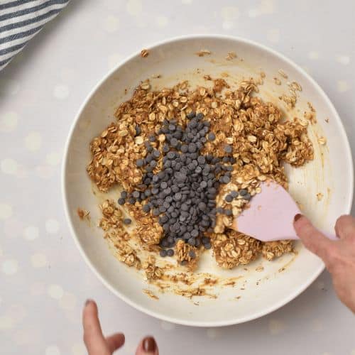 Mixing Healthy Homemade Granola Bar ingredients in a bowl.