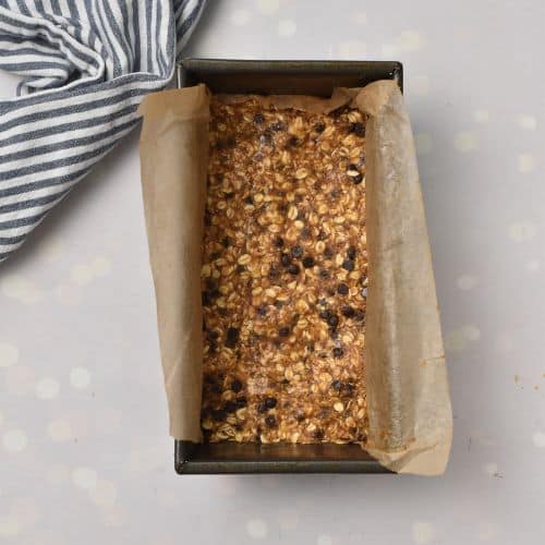 Healthy Homemade Granola Bars pressed in a pan ready to set.