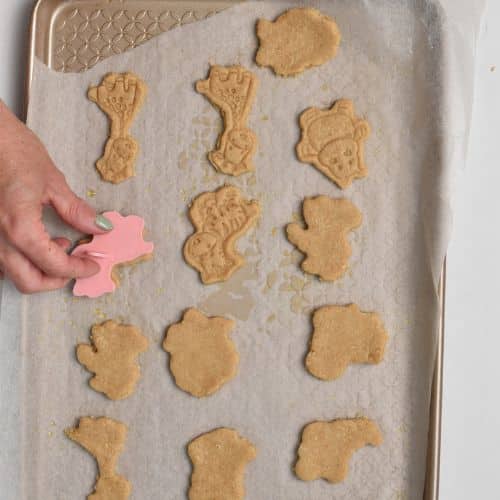 Pressing the animal shapes on the Homemade Animal Crackers