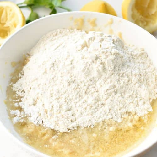 Adding flour to the base Lemon Banana Bread ingredients.