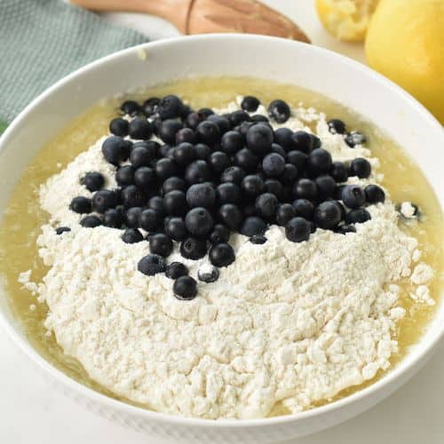 Adding flour and blueberry to the Lemon Blueberry Bread base.