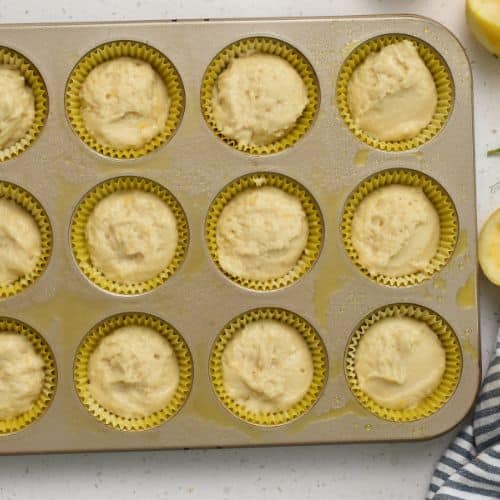 Lemon Yogurt Muffins ready to bake in a muffin tin.