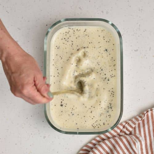 Stirring peanut chia seed pudding.