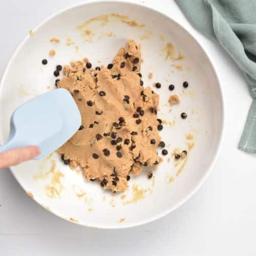 Mixing Protein Bark dough base in a bowl.