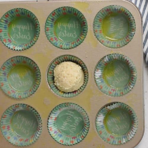 Transferring the Yogurt Muffin dough into a muffin tin.